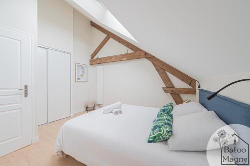 Ένα ή περισσότερα κρεβάτια σε δωμάτιο στο Chez Groot - à 5 min de Disneyland Paris