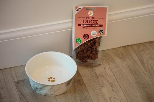 a bowl of milk next to a box of dog food at Stravaig in Innerleithen