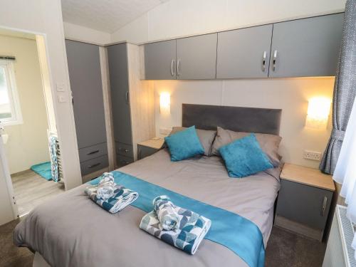 Ένα ή περισσότερα κρεβάτια σε δωμάτιο στο Blossom Vale Lodge