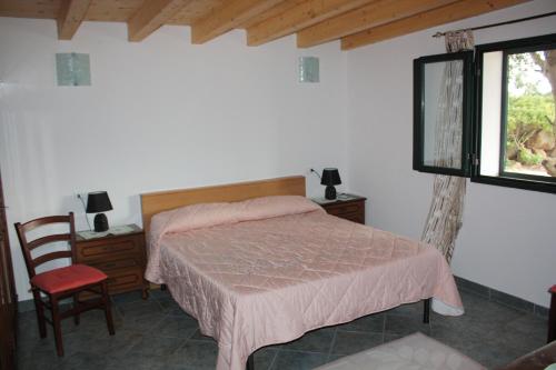 מיטה או מיטות בחדר ב-La Ginestra