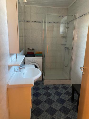 a bathroom with a sink and a shower at Ferienwohnung Maier in Fürstenfeld