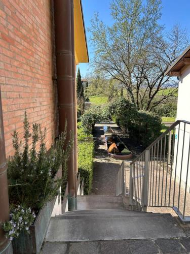 a stairway leading up to a brick building at Locanda La Cavallina in Brisighella