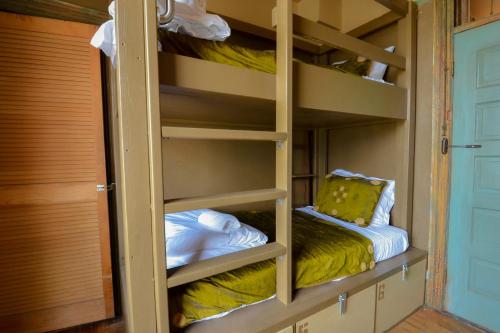 a bunk bed in a tiny house with a bunk bedscribed at Michie Hostel in Providence