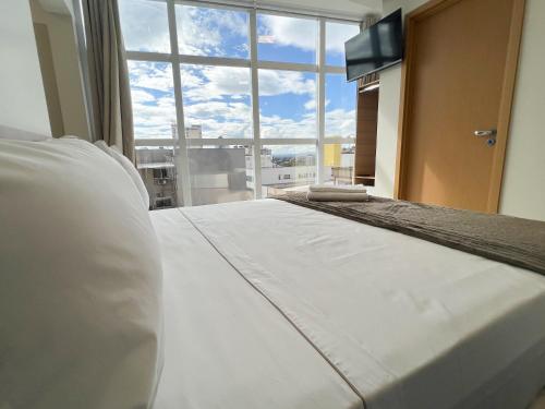 Katil atau katil-katil dalam bilik di Elite Business Hotel