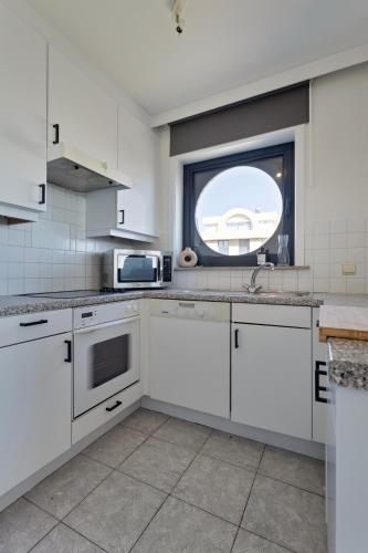 Cuisine ou kitchenette dans l'établissement Cosy Calmeyn