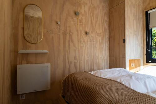 Katil atau katil-katil dalam bilik di Knus gezinsverblijf in Cosi Tiny House op de Veluwe