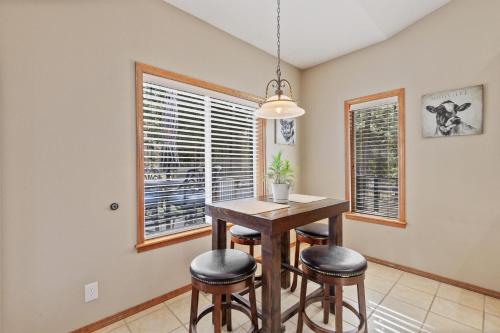 a dining room with a table and stools at 8732 Clarkview in Hayden