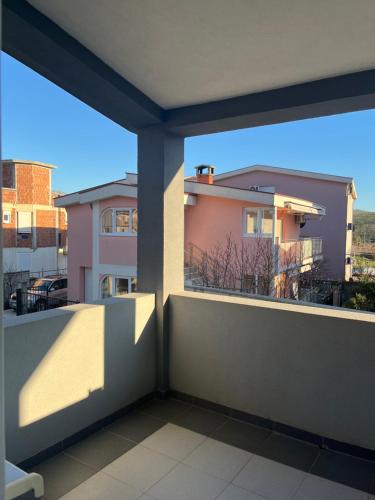 a balcony with a view of a building at Apartmani Dasic in Sutomore