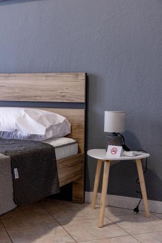 Postel nebo postele na pokoji v ubytování ANGO City Center