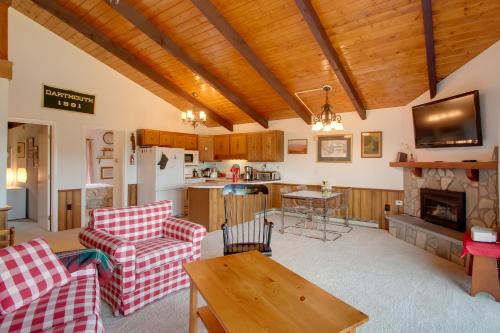 a living room with a couch and a table at Mountaintop Condo with Great Mt Washington View in Glen