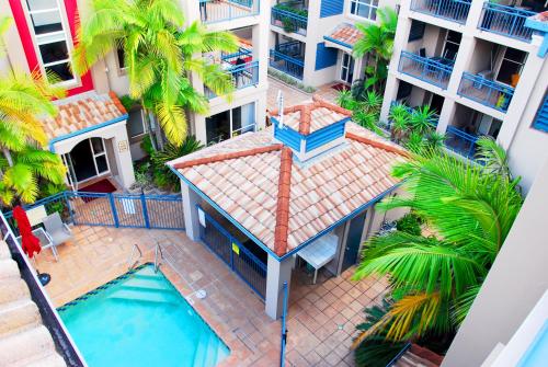 an aerial view of a building with a swimming pool at Montego Sands Resort in Gold Coast