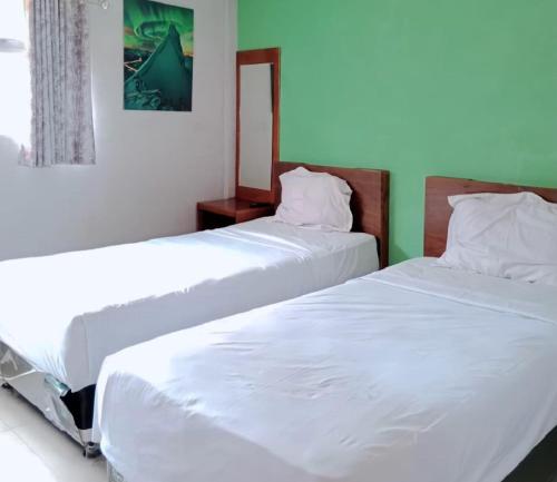 Una cama o camas en una habitación de The Aurora by Makati