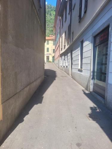 an empty alley between two buildings in a city at COSY and CHIC to the LAKE in Como