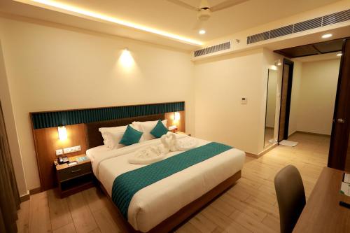 a bedroom with a large bed in a room at Viraj Retreat in Munroe Island