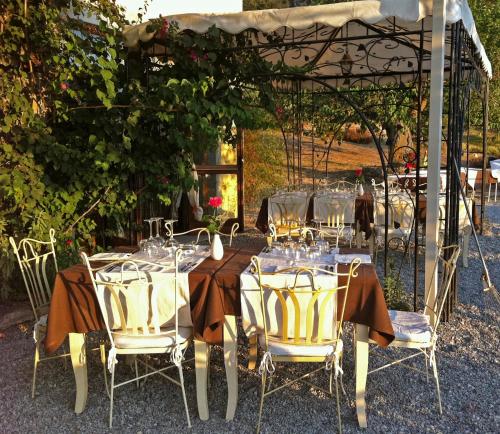 a group of tables and chairs under a gazebo at Antica Tindari in Patti
