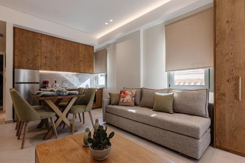 a living room with a couch and a table at 1864 Apartments in Zakynthos