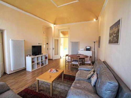 a living room with a couch and a table at Apartment Roma by Interhome in Porto Valtravaglia