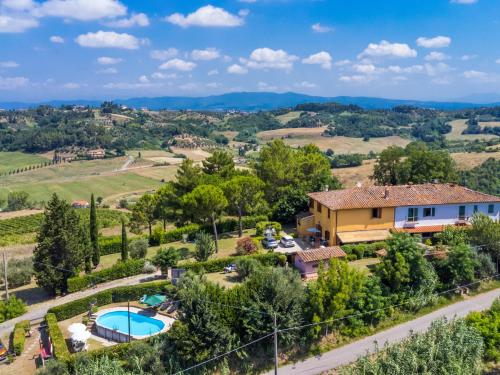 an aerial view of a property with a swimming pool and a house at Apartment L'Uccelliera-3 by Interhome in Canneto