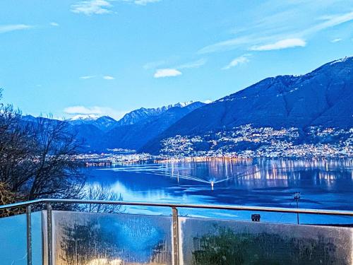 a view of a body of water with mountains at Apartment Splendid Maggiore View by Interhome in Magadino