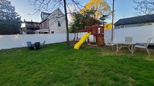 a backyard with a playground with a table and chairs at Sunny & Spacious 2BD 1BA WFH Apt-Huge Yard & Patio in Fairfield