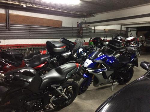 a row of motorcycles parked in a garage at Roch Hotel in Altrón