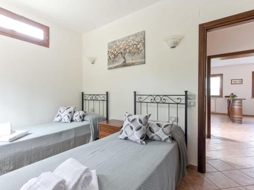 Katil atau katil-katil dalam bilik di Holiday Home Il Cipresso by Interhome