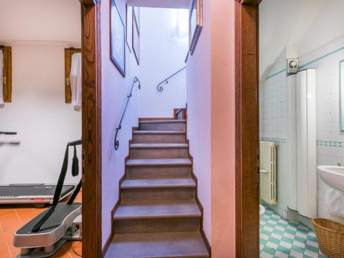a stairway leading to a bathroom with a sink at Holiday Home Villa Silvana by Interhome in Marcialla