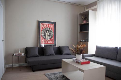a living room with a couch and a coffee table at Apartamentos Concepcion in Albacete