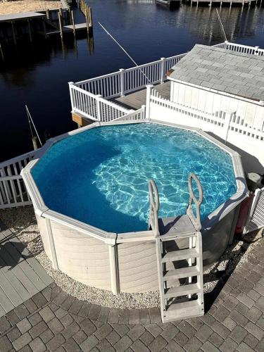 a large swimming pool in the middle of a body of water at Beach Haven West Has It All, Pool, Hot Tub in Beach Haven West