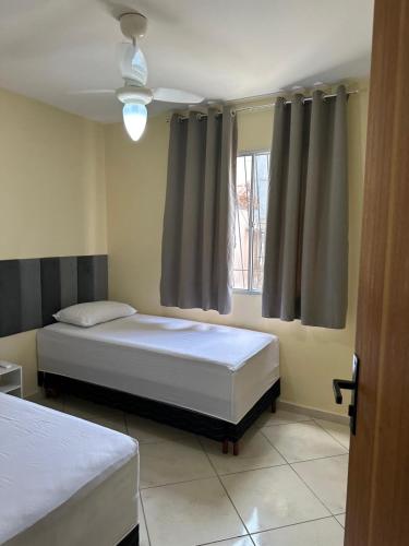 Ένα ή περισσότερα κρεβάτια σε δωμάτιο στο Apartamento aconchegantes em AC