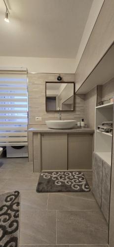 a bathroom with a sink and a mirror at La Casetta in Pescolanciano