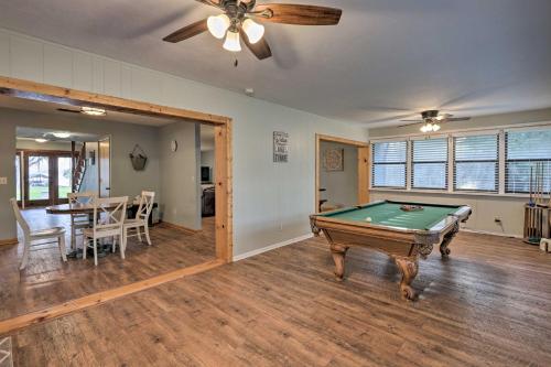 a living room with a pool table in it at 20 Mi to UF Campus Santa Fe Lake Escape with Dock! in Waldo