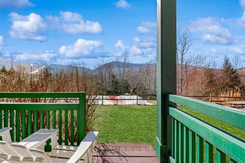 a porch with a bench and a view of the mountains at Eagles Unit #2 in Jeffersonville