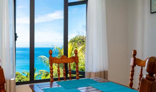 a dining room with a view of the ocean at CASA GEM in Victoria