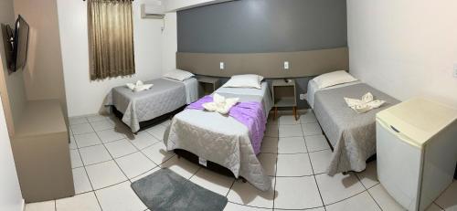 Katil atau katil-katil dalam bilik di PORTAL PARQUE HOTEL