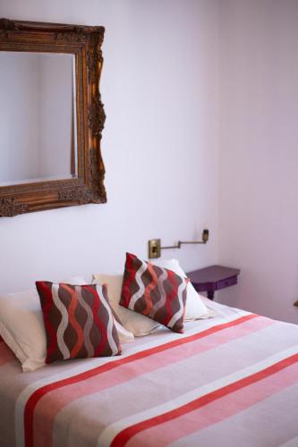 Postel nebo postele na pokoji v ubytování Meridiano Hostel Boutique