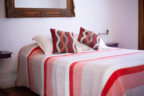 Postel nebo postele na pokoji v ubytování Meridiano Hostel Boutique
