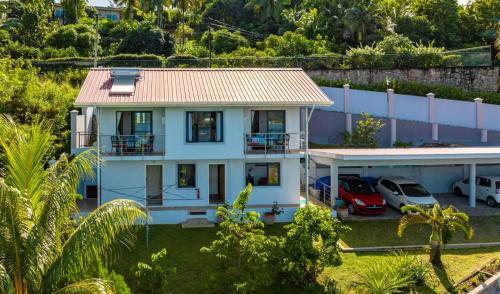 an aerial view of a house with a parking lot at CASA GEM in Victoria