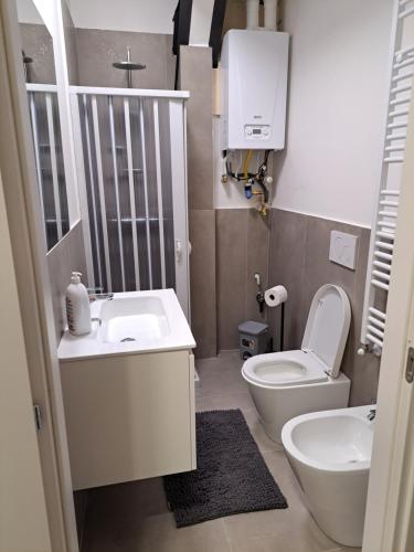 a small bathroom with a toilet and a sink at San Francesco Home in Terni