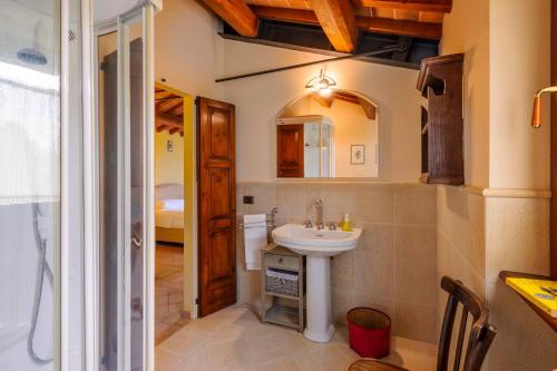 a bathroom with a sink and a mirror at Villa Emilianna 12&2 by Marche Holiday Villas in Fano