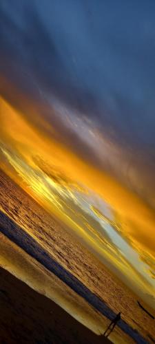a person walking on the beach at sunset at Casa Il Cecio in Roccalbegna