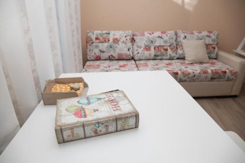 a living room with a bed and a couch at Apartment Retro 8 in Dobrich