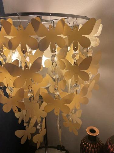 a chandelier with yellow flowers hanging from a ceiling at Serenity Inn in Niagara Falls