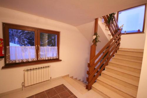 a staircase in a house with a window at Haus Izabella in Filzmoos