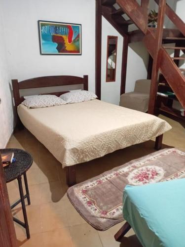 Ένα ή περισσότερα κρεβάτια σε δωμάτιο στο Quarto Duplex - Enseada Azul