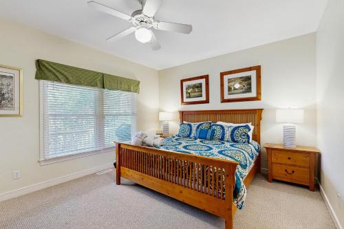 a bedroom with a bed and a ceiling fan at The Green Ocean in Kiawah Island