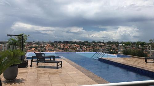 a swimming pool with a view of a city at Studio Duo Jk Evidências 15 in Sao Jose do Rio Preto