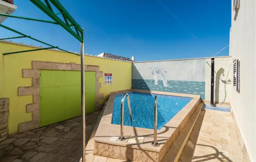 a swimming pool in the backyard of a house at Gorgeous Home In Selca in Selca