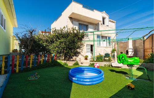 a playground with a blue frisbee on the grass at Gorgeous Home In Selca in Selca