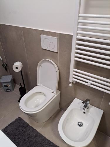 a bathroom with a toilet and a sink at San Francesco Home in Terni